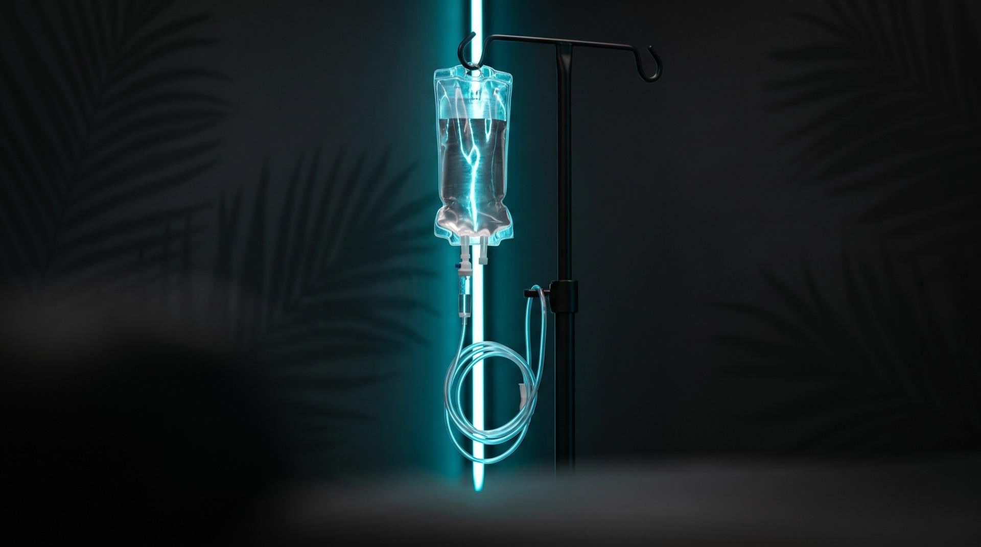 An Elite Infusions IV bag glowing cyan
